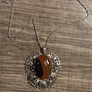 Intricate Silver and Brown Pendant Necklace